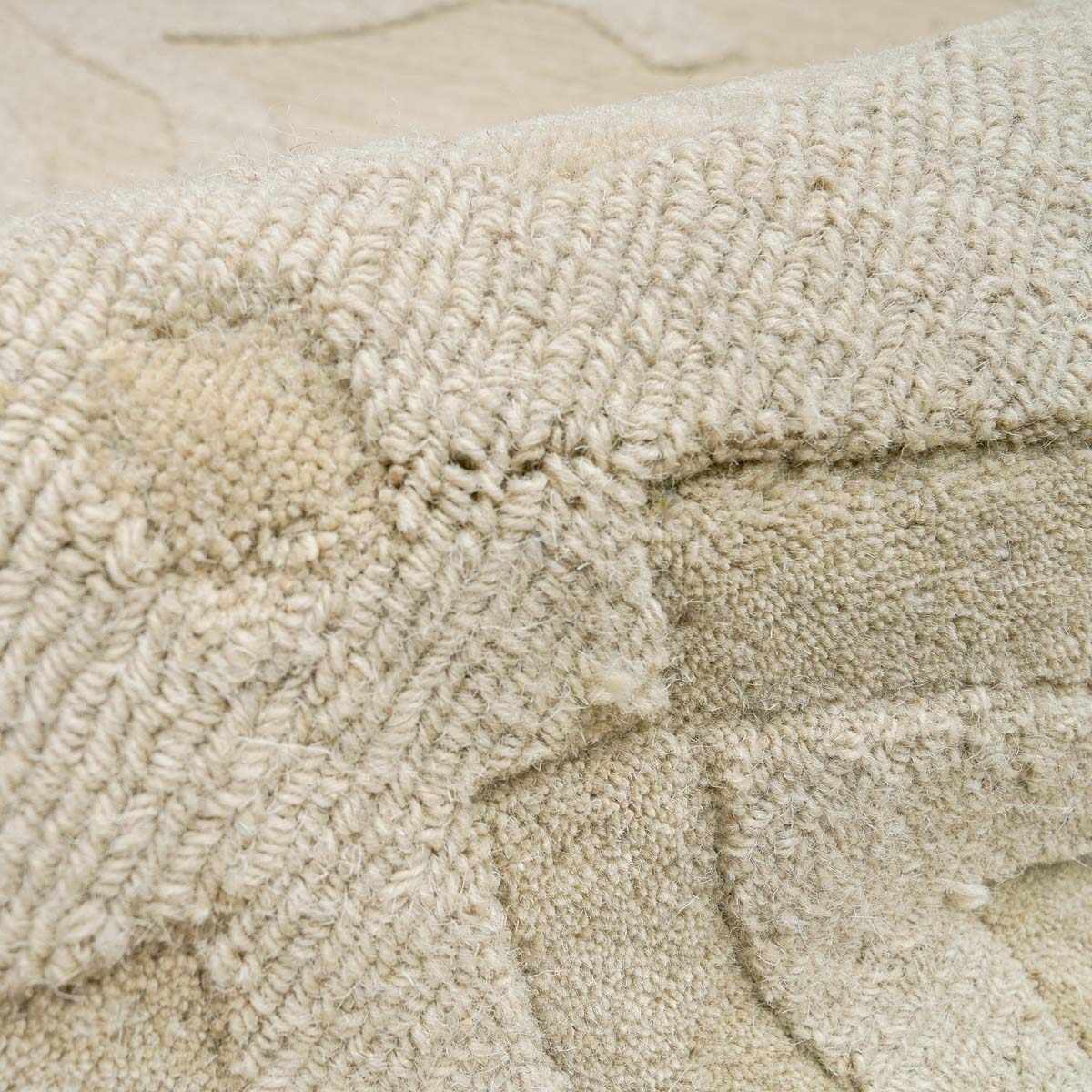 Fyffe Embossed Beige Wool Area Rug